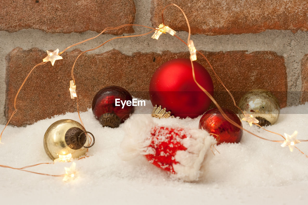 High angle view of christmas decoration against a brick wall 