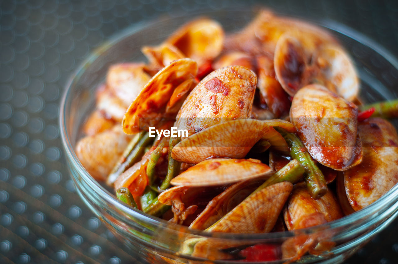 Spicy paphia textile, or known as retak seribu lala fried with chillies. served in a bowl.