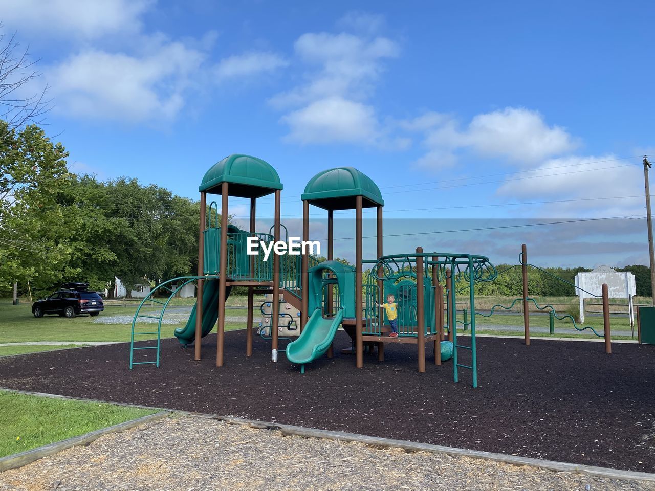 VIEW OF PLAYGROUND IN PARK AGAINST SKY