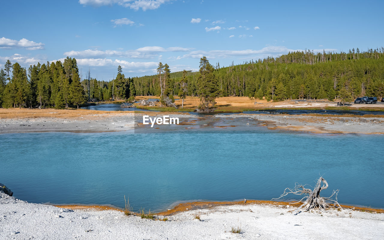 Scenic view of hotspring by geothermal landscape at famous yellowstone park