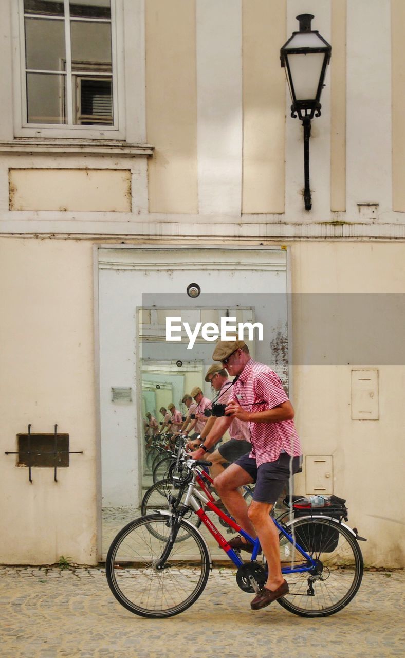 Man riding bicycle in city