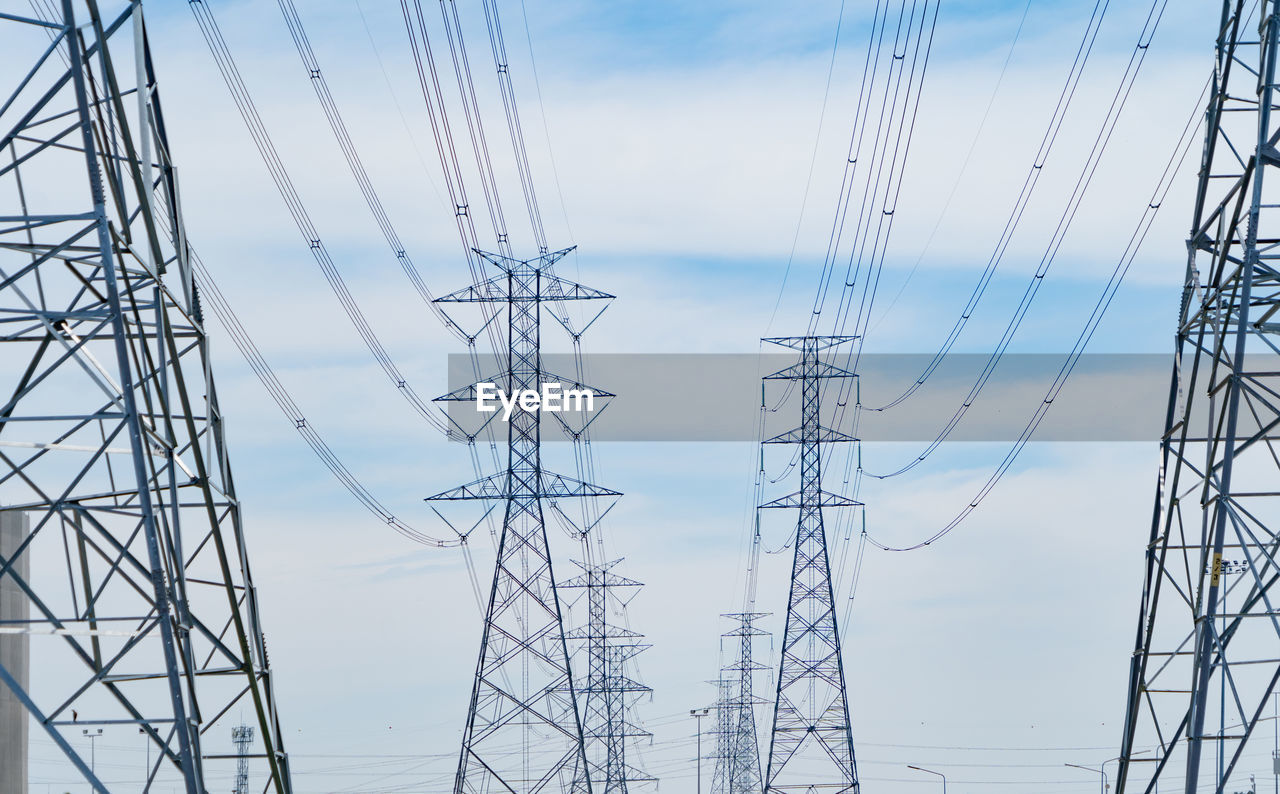 LOW ANGLE VIEW OF POWER LINES AGAINST SKY