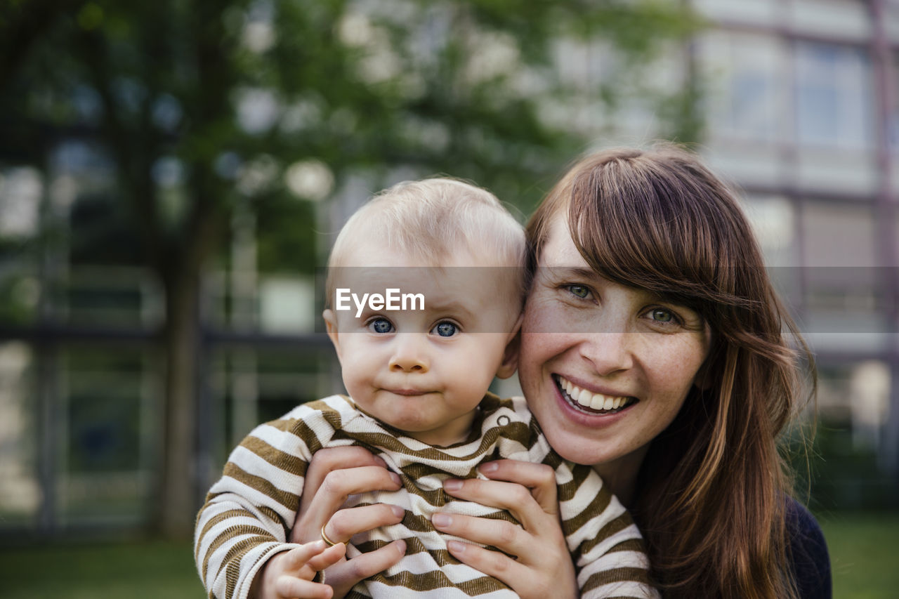 Portrait of happy mother with her baby boy