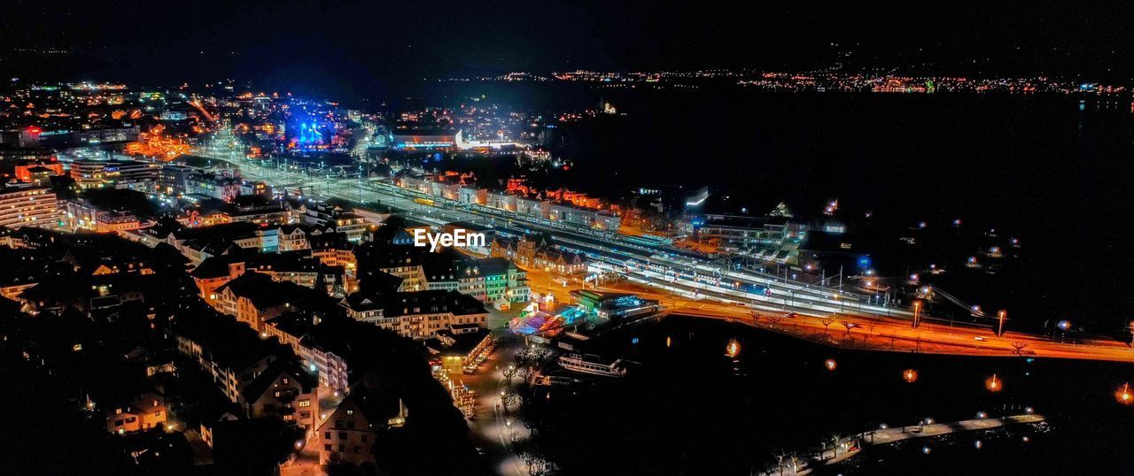 High angle view of illuminated bridge over river at night