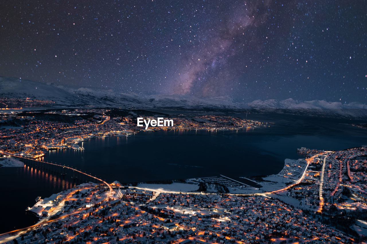 Tromsøysundet tromsø norway landscape and cityscape panorama with mountainous background in winter. 