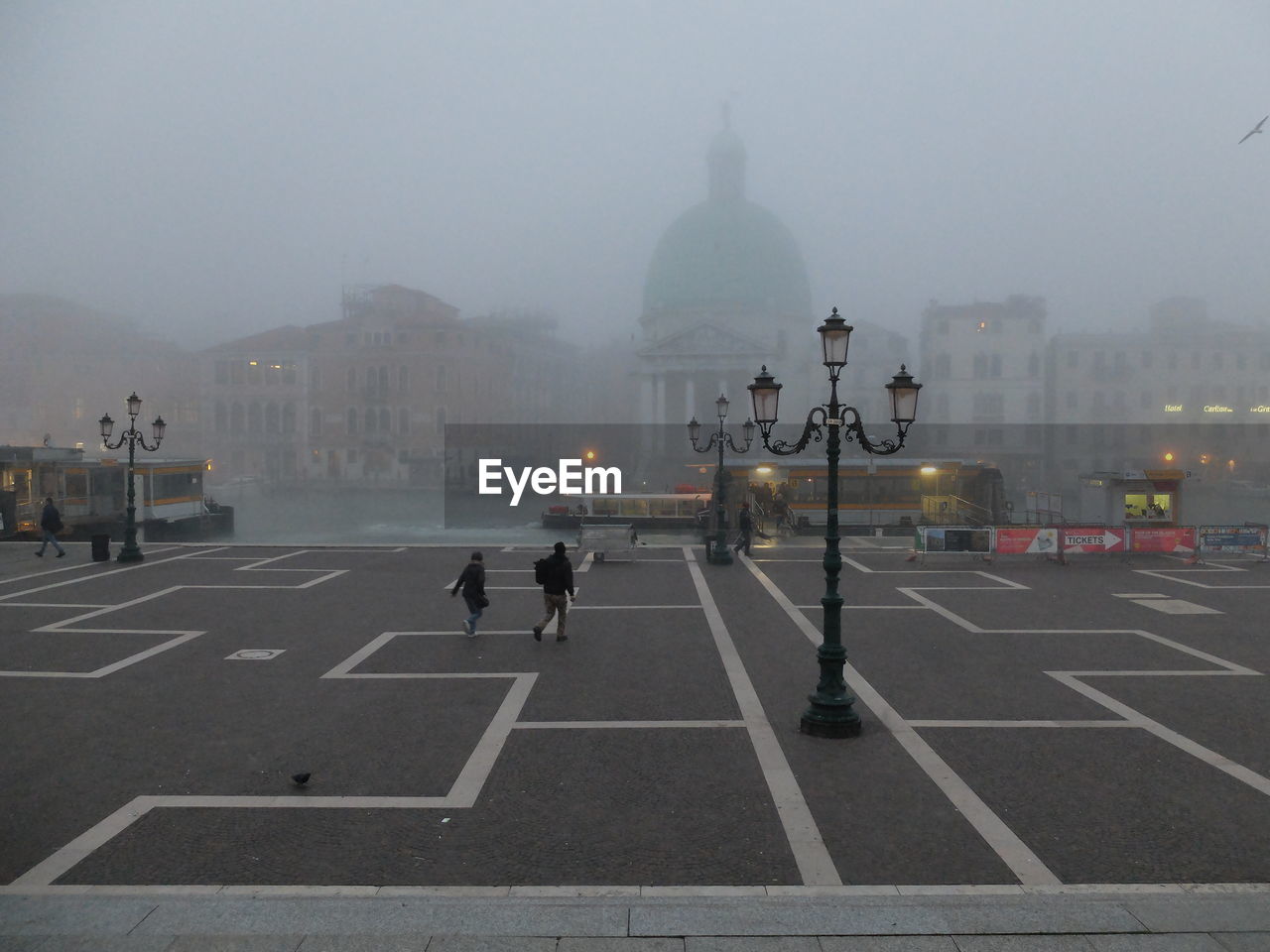 REAR VIEW OF PEOPLE IN FOGGY DAY