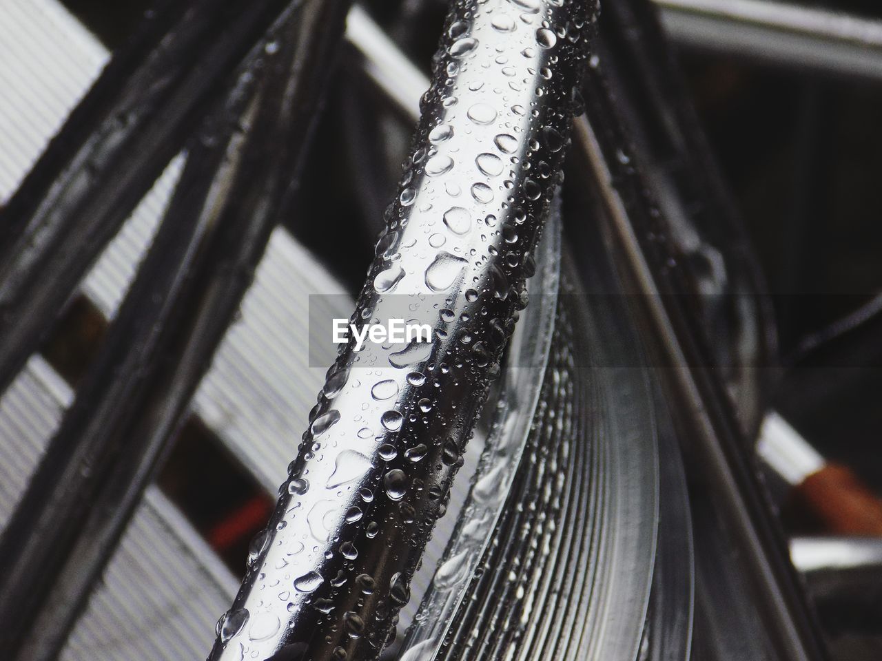 Close-up of wet bicycle during winter