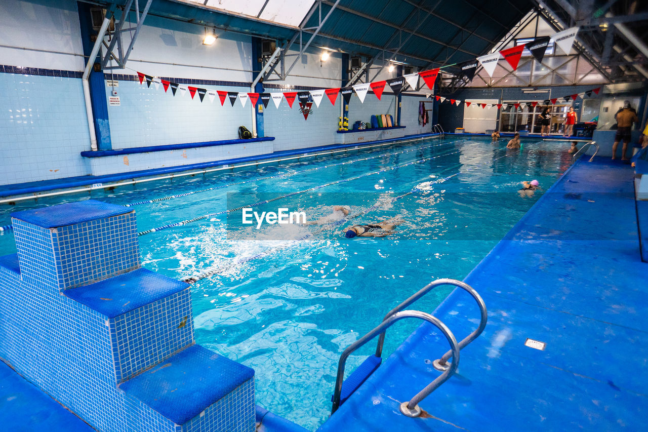 High angle view of swimming in pool