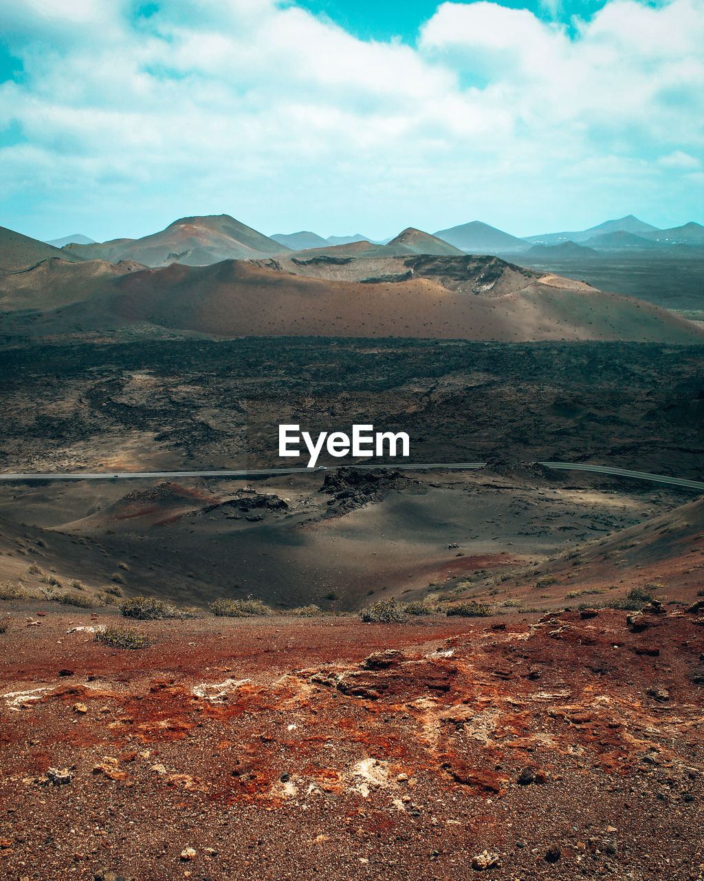 mountain, environment, landscape, scenics - nature, sky, cloud, wilderness, beauty in nature, land, nature, natural environment, mountain range, no people, non-urban scene, travel destinations, desert, tranquility, travel, tranquil scene, rock, day, horizon, plateau, soil, outdoors, volcano, valley, geology, arid climate, climate, sea, water, extreme terrain, volcanic landscape, remote, semi-arid, tourism, physical geography