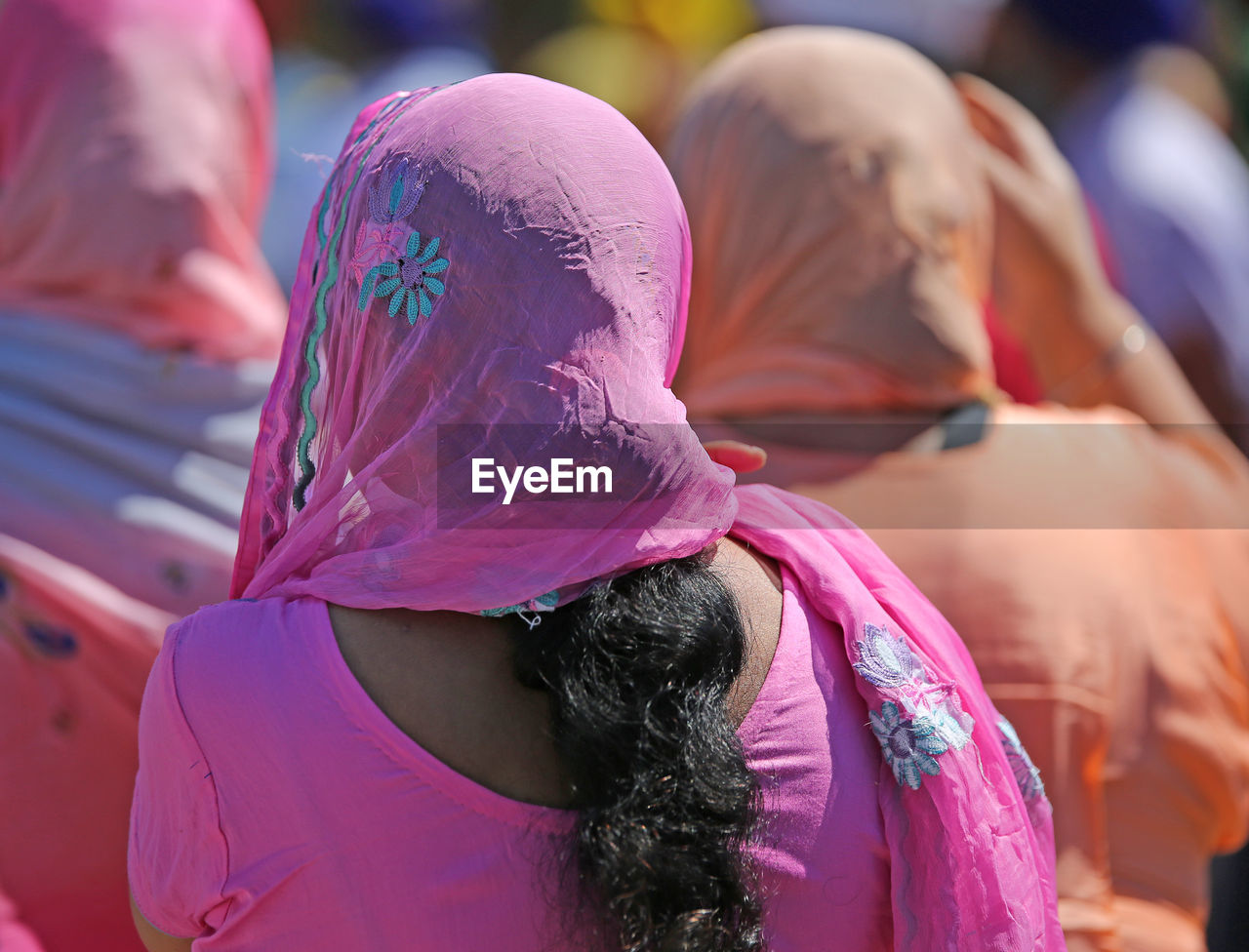 Rear view of women with dupatta on head