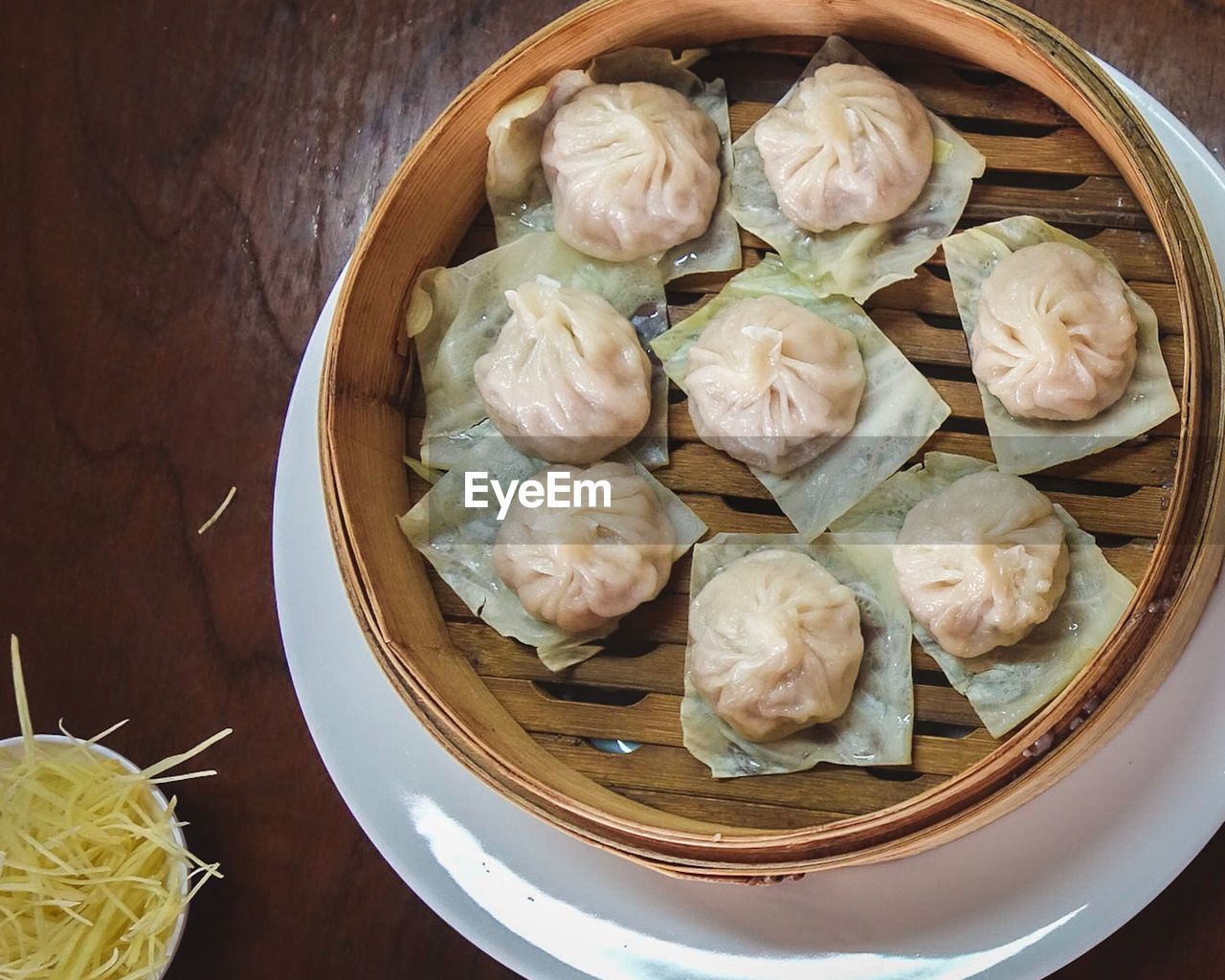 High angle view of dumplings in bamboo container at table