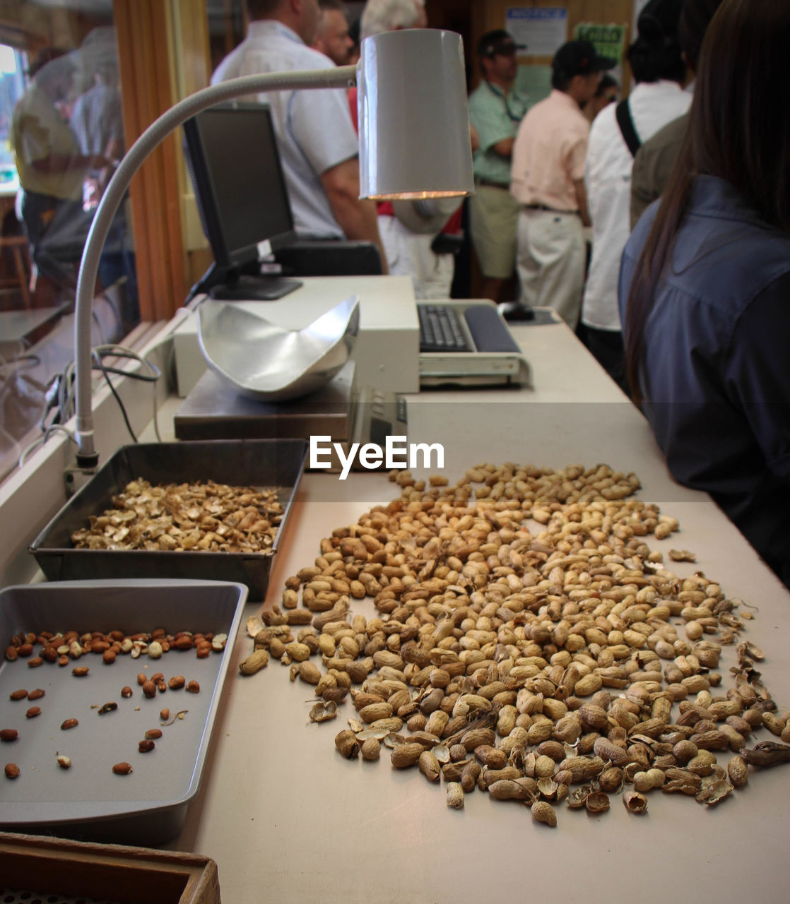 High angle view of peanuts on texting counter at store