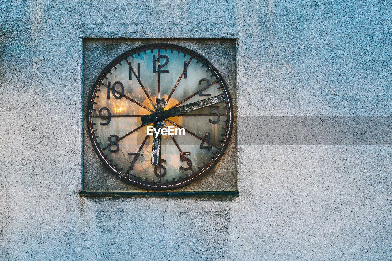 Close-up of clock on wall