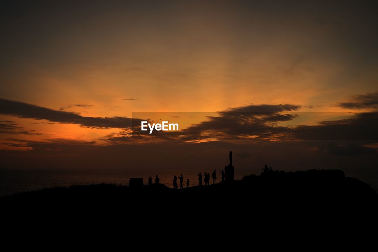 Silhouette of building during sunset