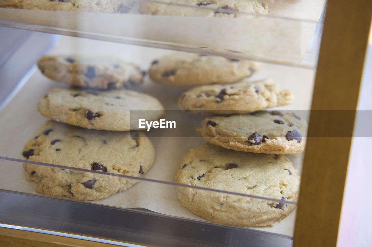 High angle view of chocolate chip cookies on display in a coffee shop