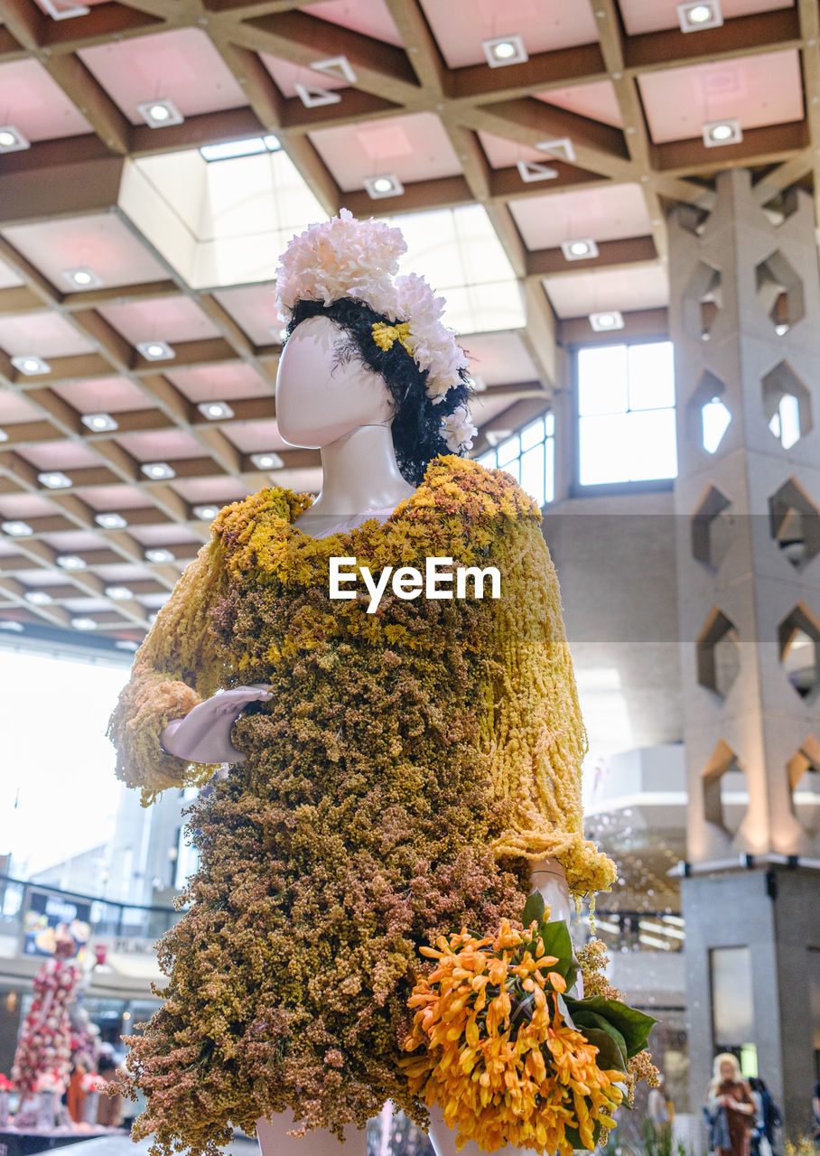 flower, retail, business, adult, floristry, business finance and industry, indoors, celebration, women, low angle view, plant, architecture, clothing, day, food, store, small business, holiday, standing