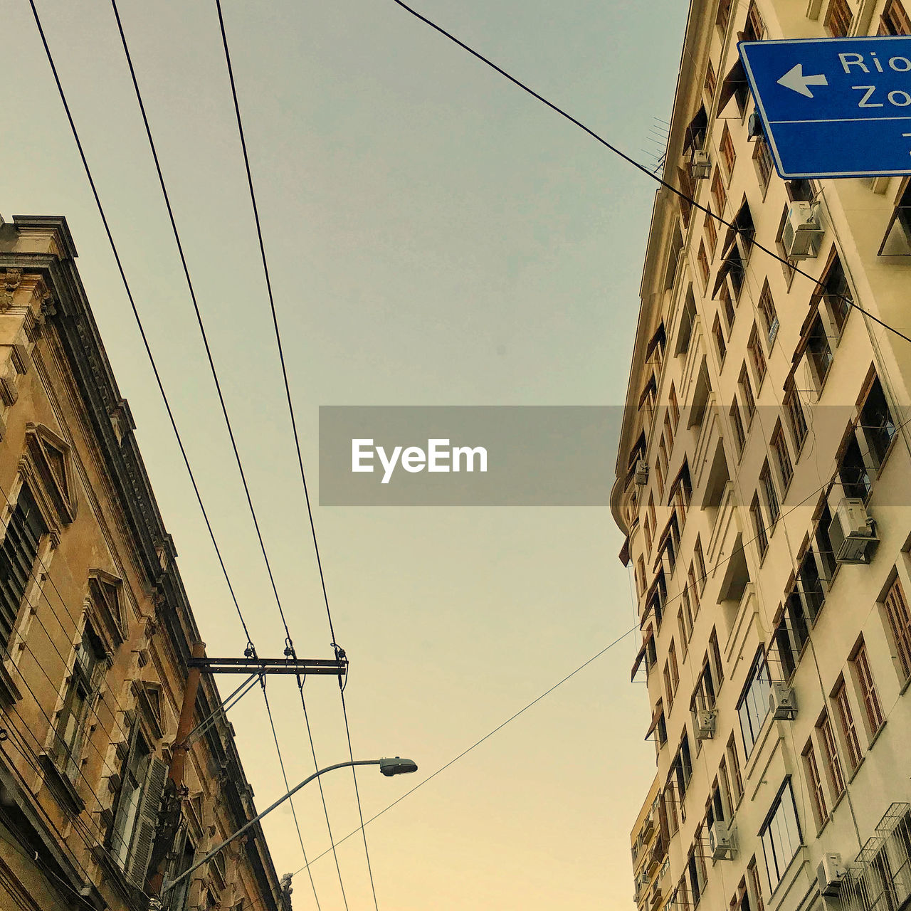 LOW ANGLE VIEW OF CABLES AGAINST SKY