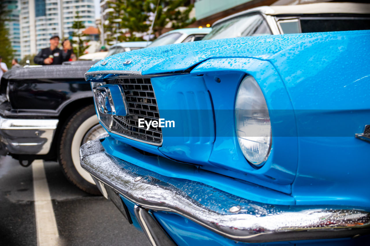 CLOSE-UP OF BLUE VINTAGE CAR