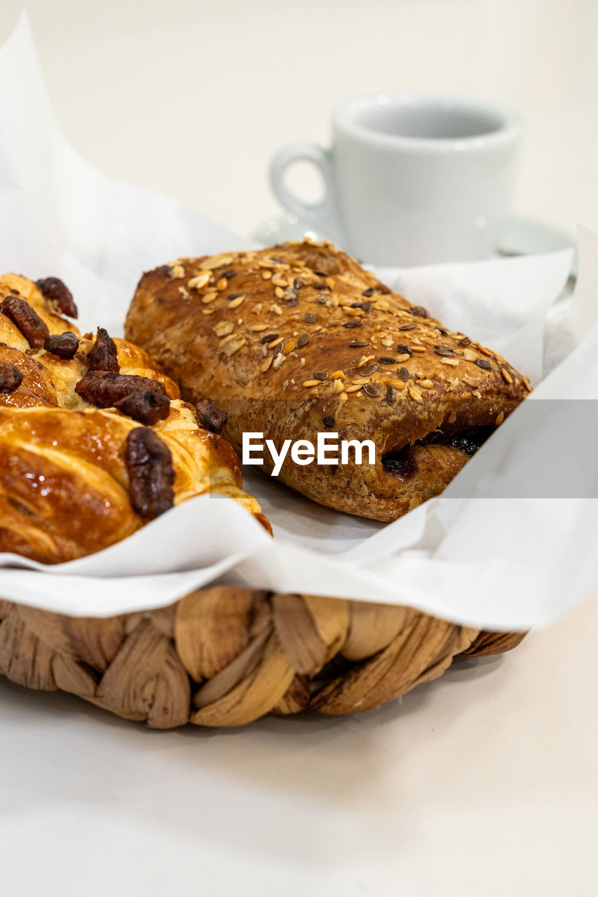 food and drink, food, breakfast, meal, dish, bread, produce, baked, snack, freshness, dried fruit, dessert, healthy eating, indoors, raisin, dried food, no people, fruit, studio shot, cup, drink, wellbeing, sweet food, close-up, mug, coffee cup, slice, plate