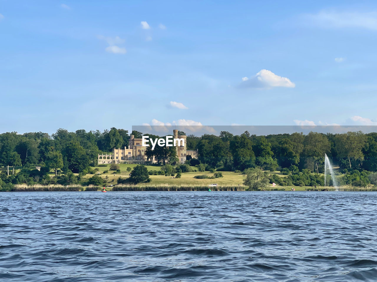 View of potsdam with the castle in park babelsberg  from the water 