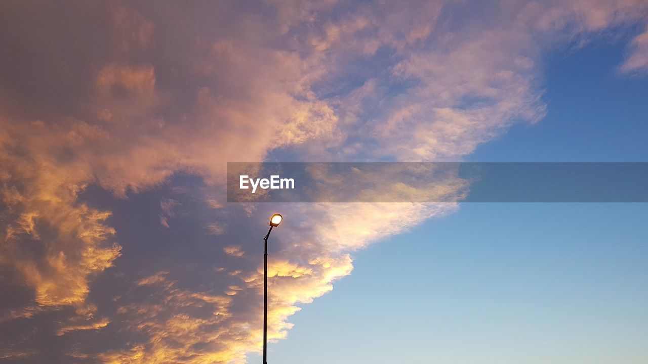 LOW ANGLE VIEW OF DRAMATIC SKY OVER SUNSET