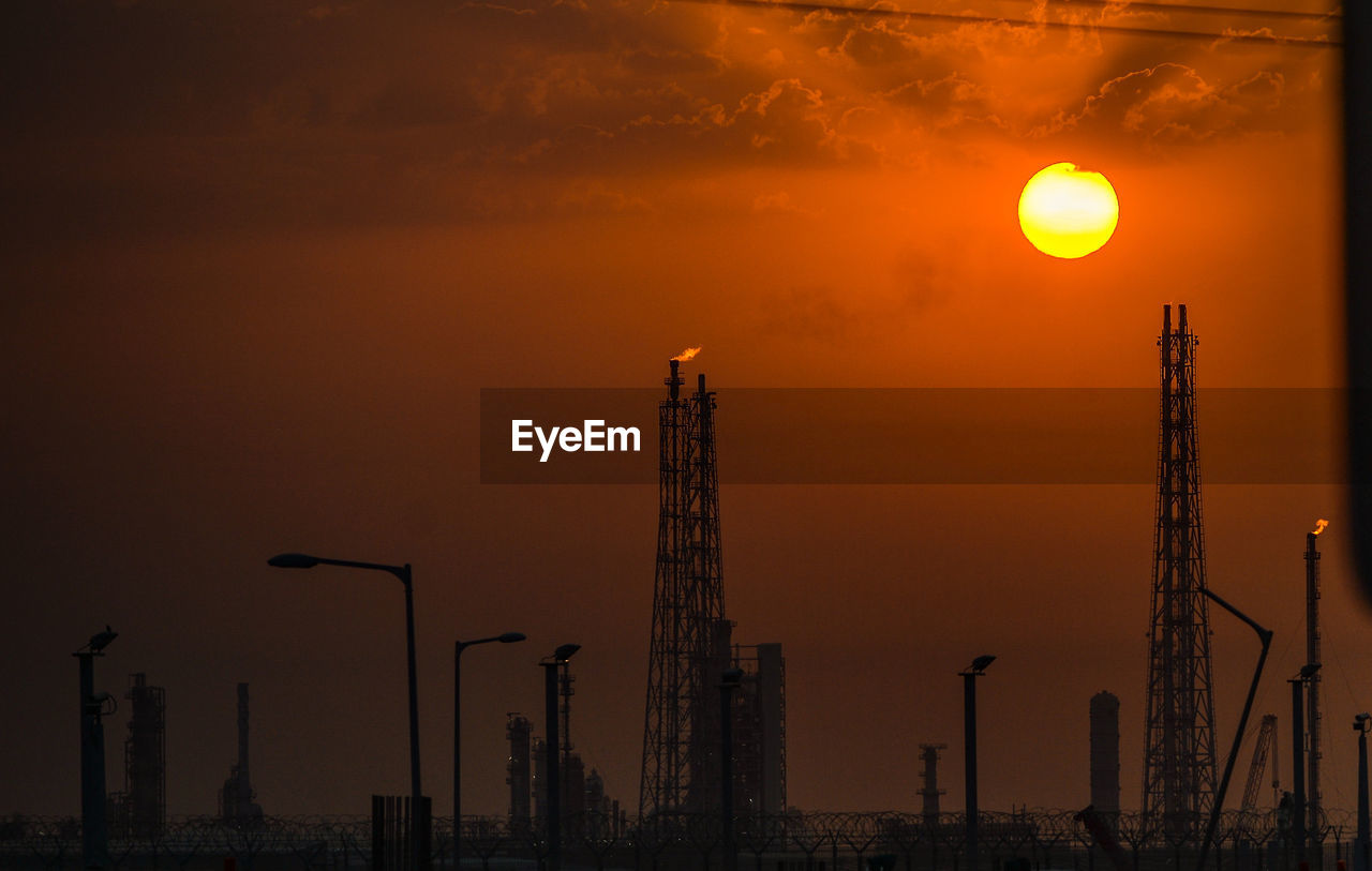 Sunrise over an oil refinery port south of kuwait city