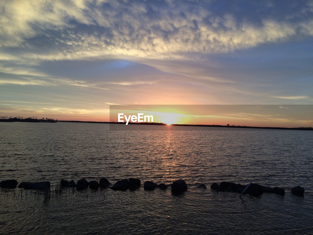 View of calm sea at sunset