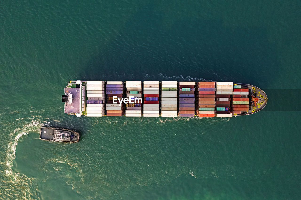 Aerial view container ship, logistic and transportation worldwide by container cargo ship boat.