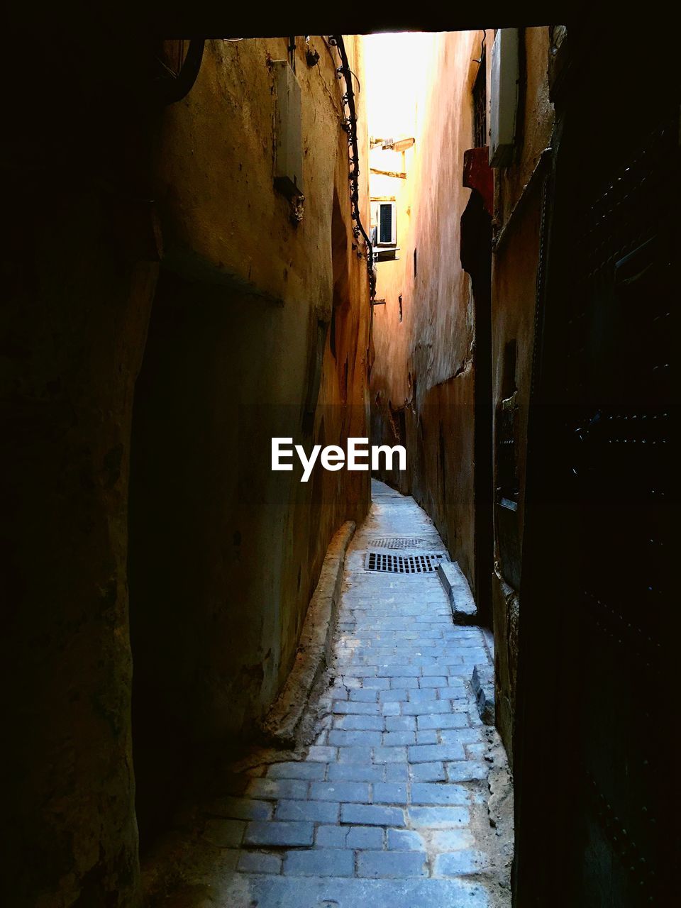 Narrow street between old buildings