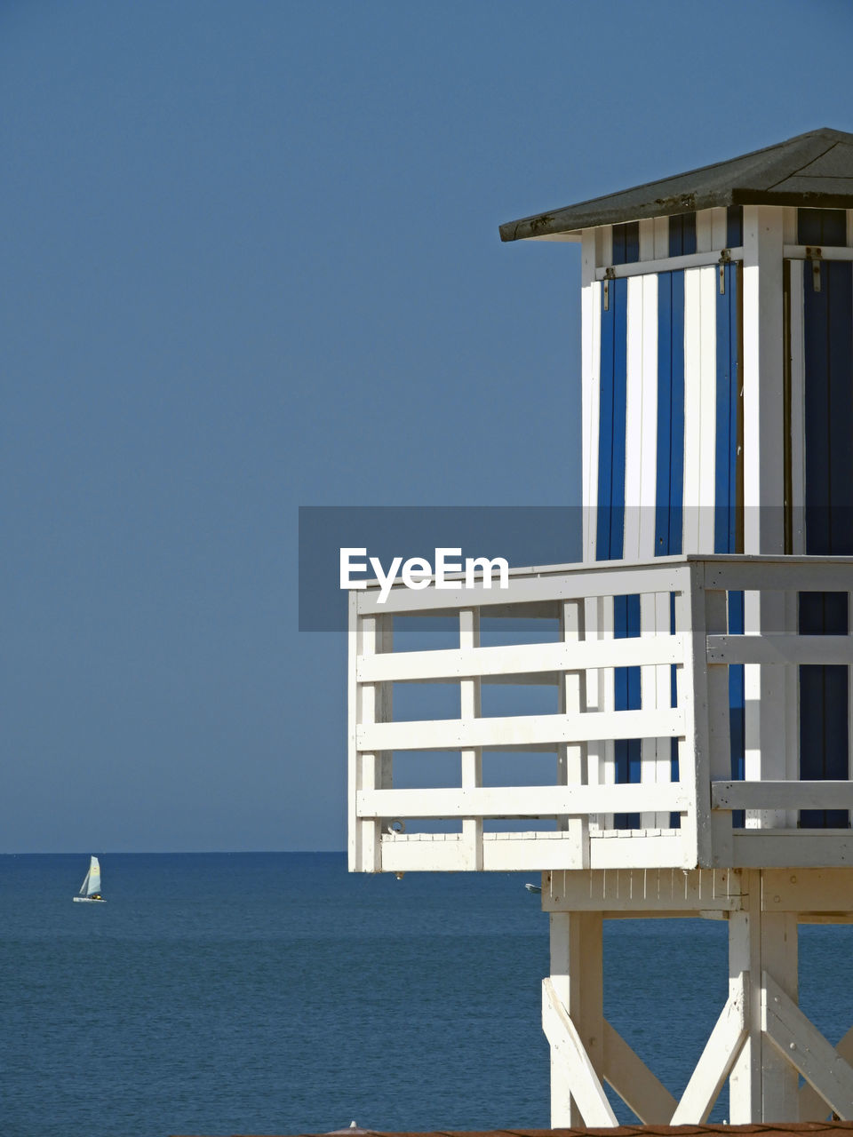 View of sea against clear blue sky