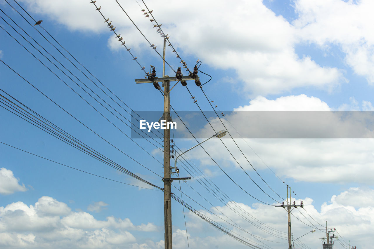 LOW ANGLE VIEW OF ELECTRICITY PYLONS AGAINST SKY