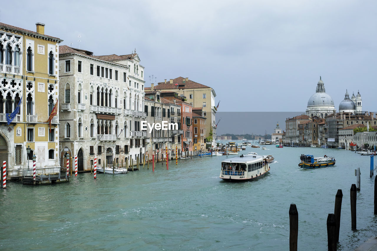 Boats in city at waterfront