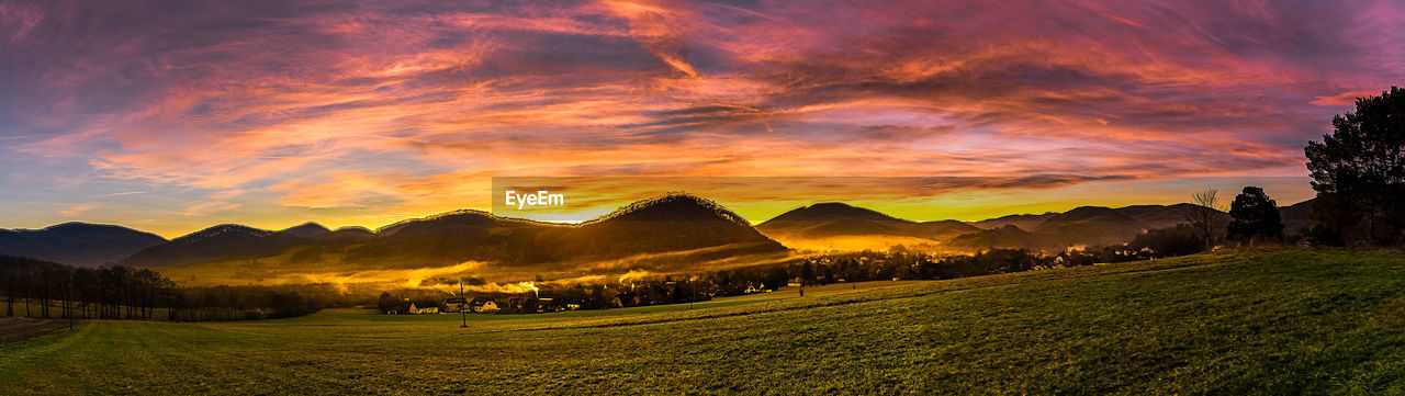 SCENIC VIEW OF DRAMATIC SKY OVER LANDSCAPE