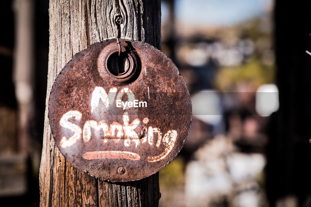Close-up of smoking sign 