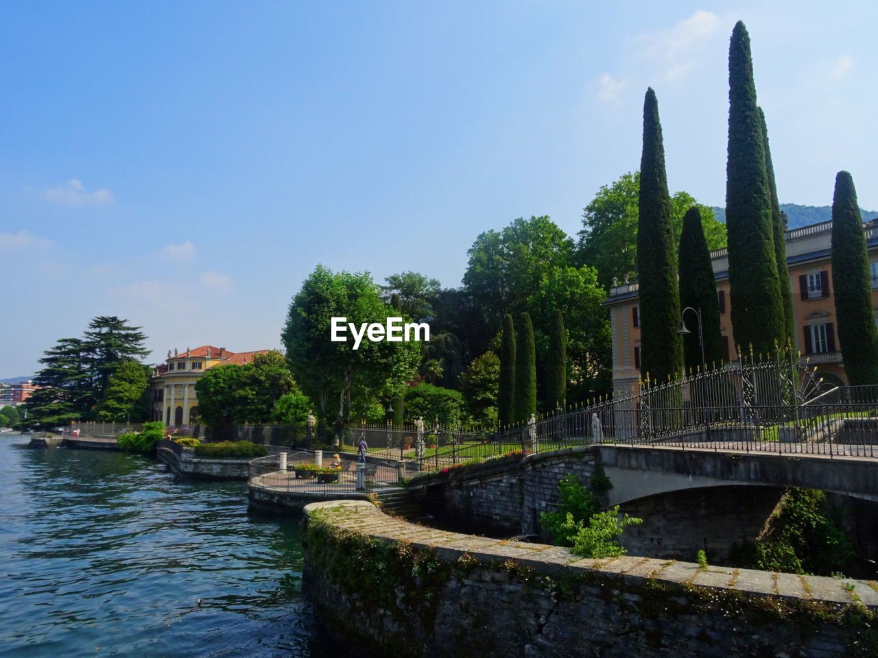 Bridge over river against italian sky