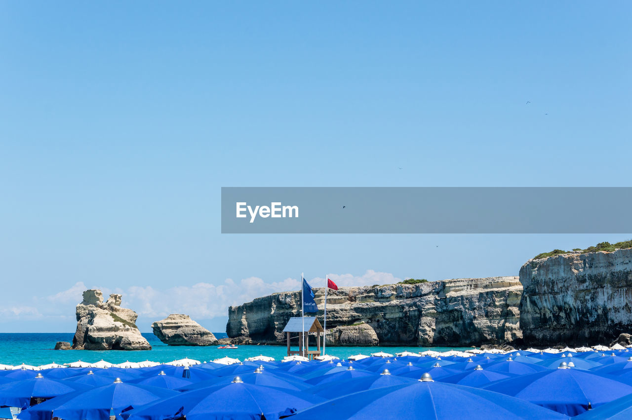 REAR VIEW OF SEA AGAINST CLEAR SKY