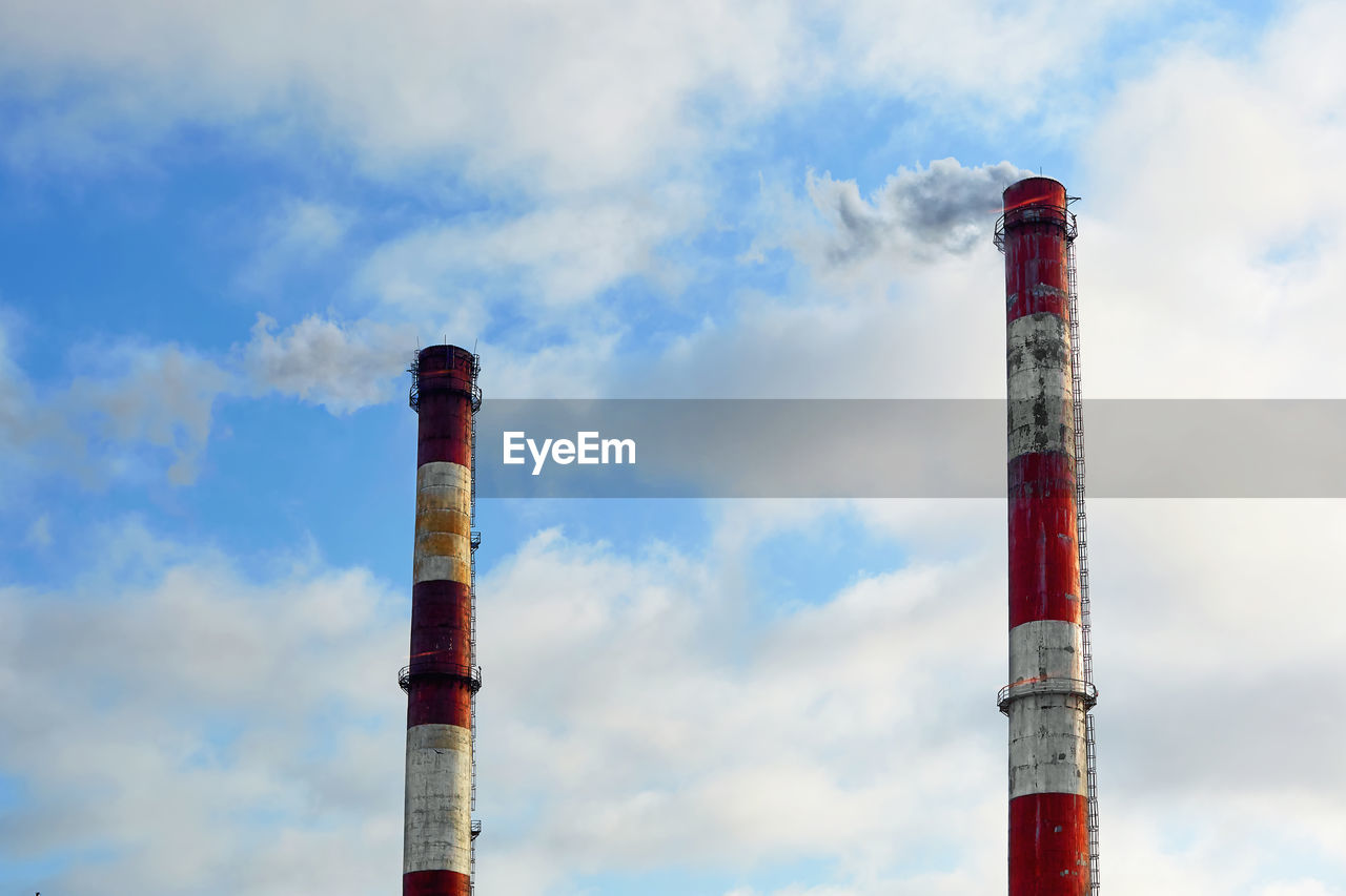 LOW ANGLE VIEW OF FACTORY AGAINST SKY