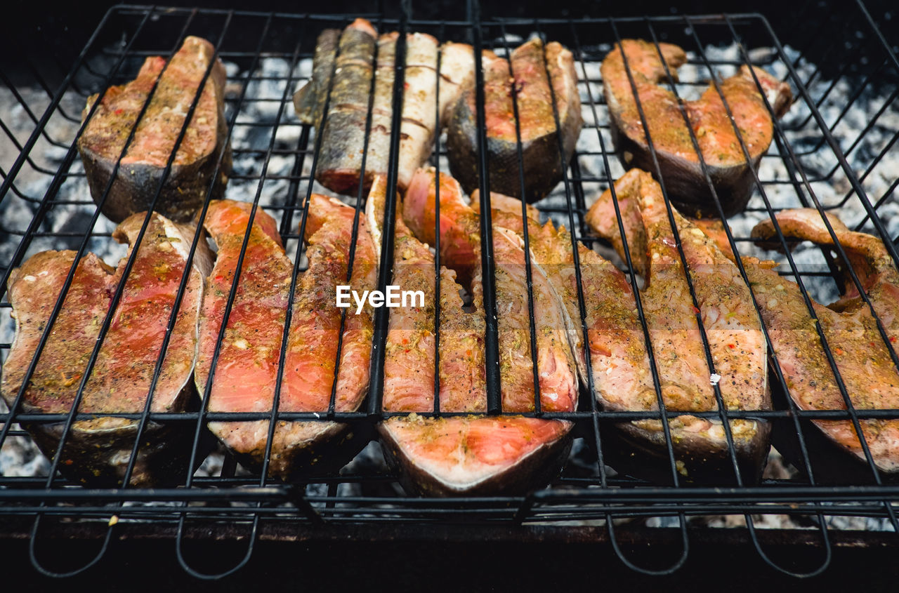 HIGH ANGLE VIEW OF AUTUMN LEAVES ON BARBECUE