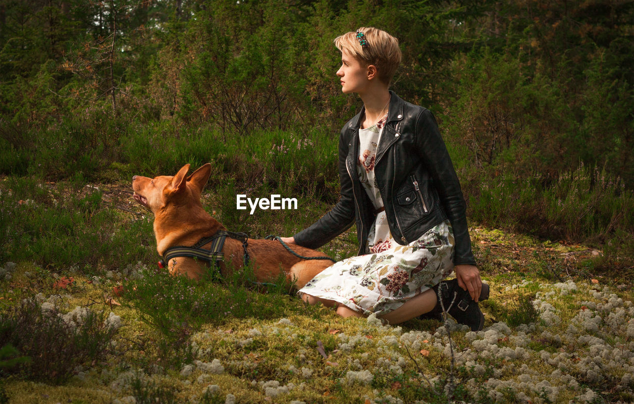 Short haired lady with dog in park scenic photography