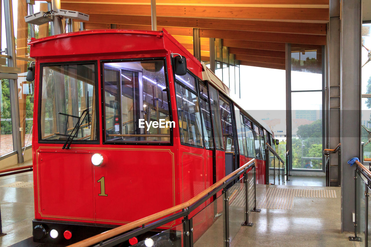 RED TRAIN AT WINDOW