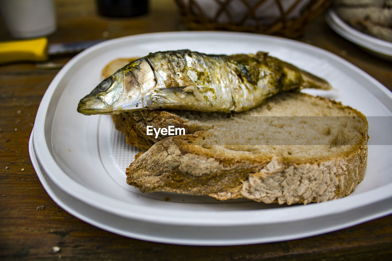 Grilled sardine on a piece of bread