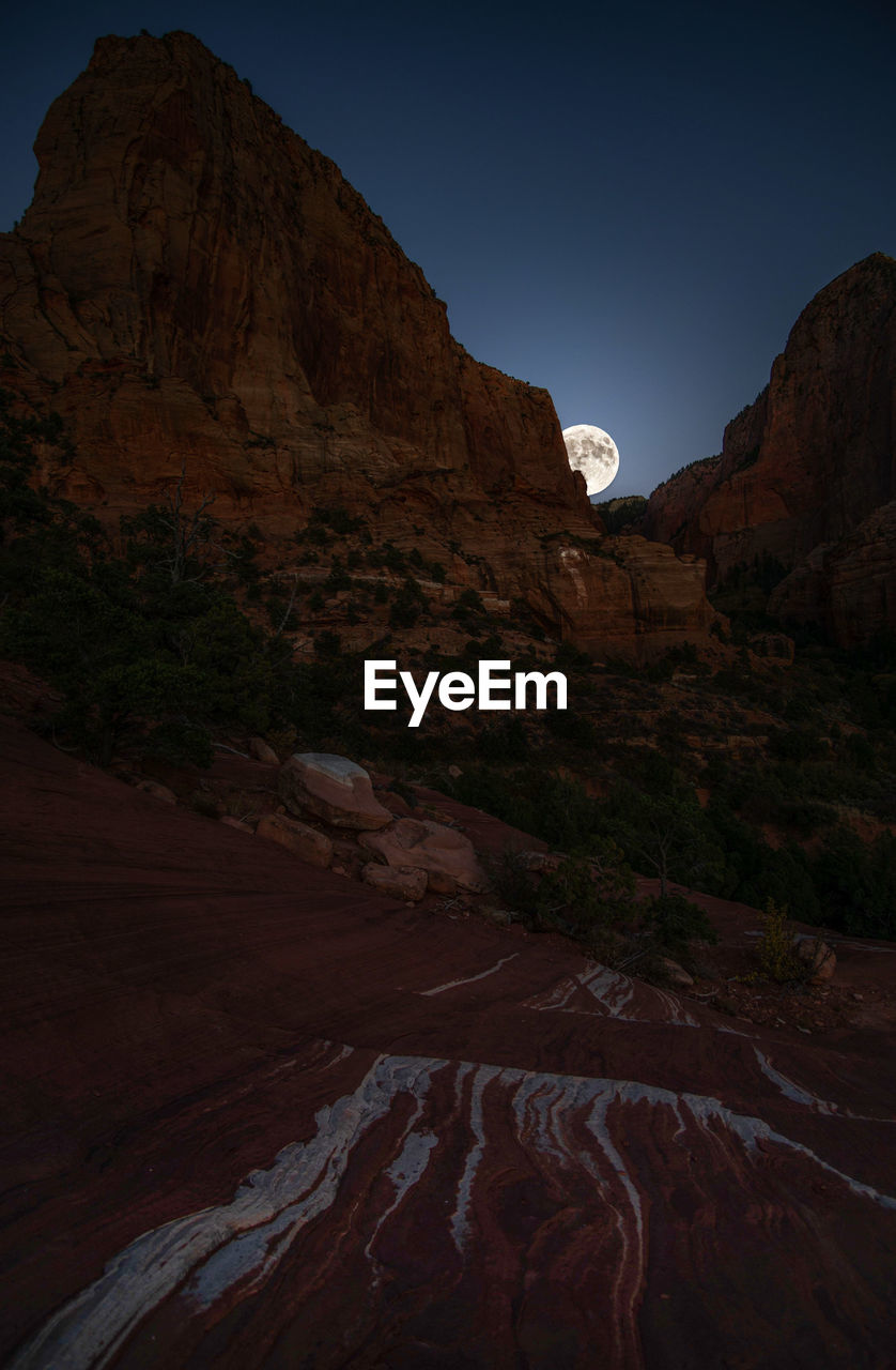 Full desert moon rise in zion national park
