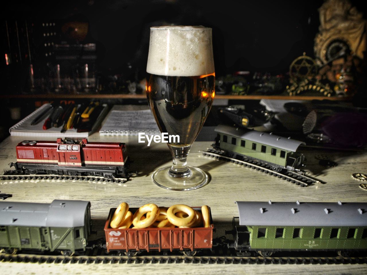 CLOSE-UP OF BEER GLASSES ON TABLE