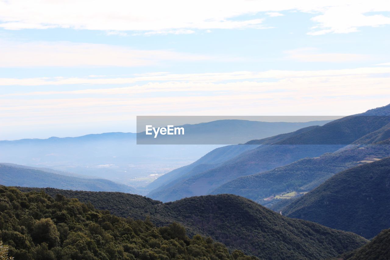 SCENIC VIEW OF VALLEY AGAINST SKY