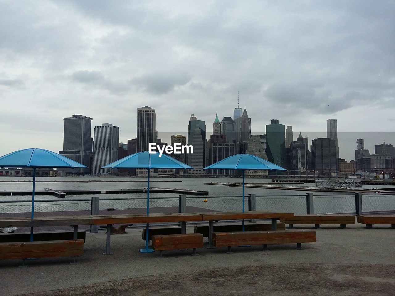 Cityscape against cloudy sky