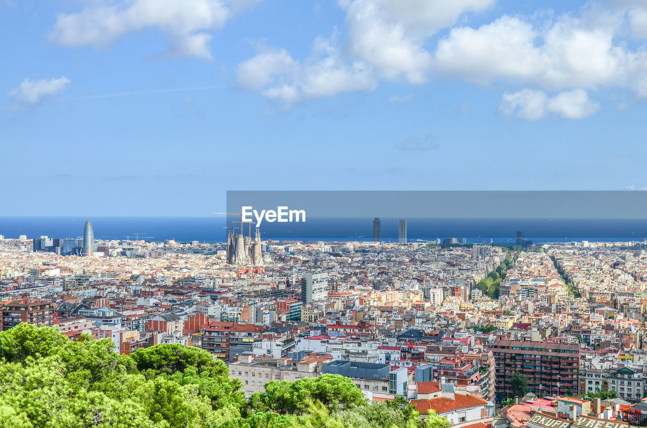 View of spain's barcelona from the hill of three crosses in güell park .