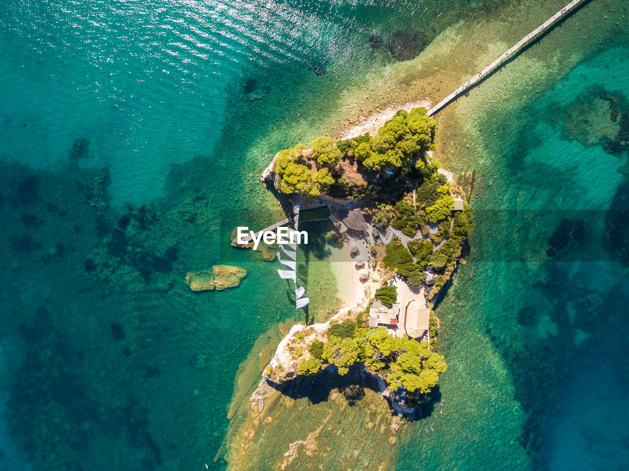 HIGH ANGLE VIEW OF SWIMMING POOL ON BEACH