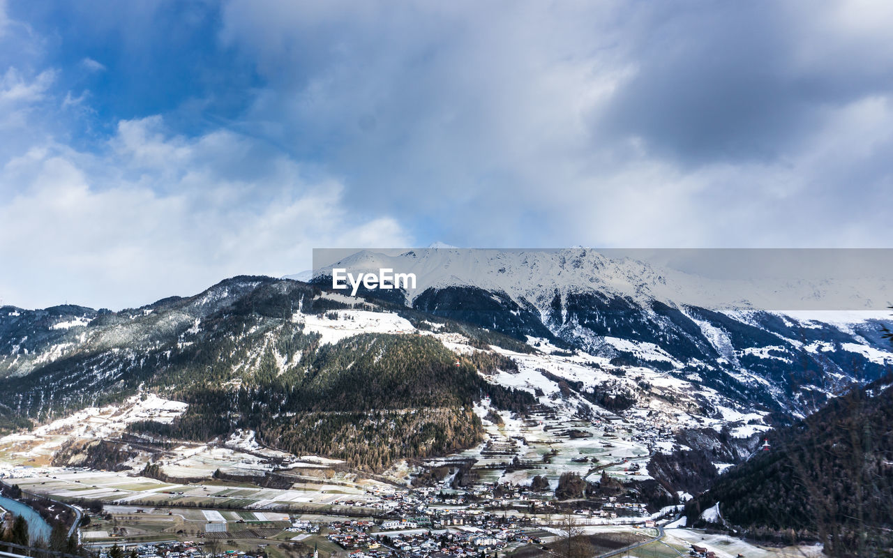 Scenic view of snowcapped mountains against sky