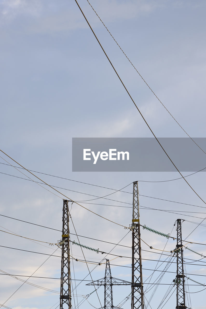 Low angle view of electricity pylon