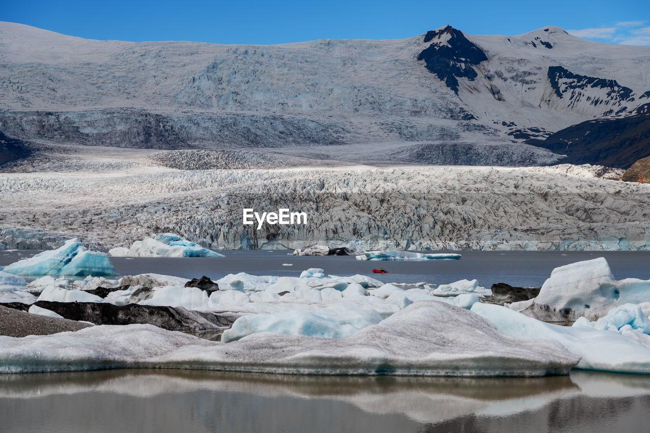 Ice floes floating in sea during winter
